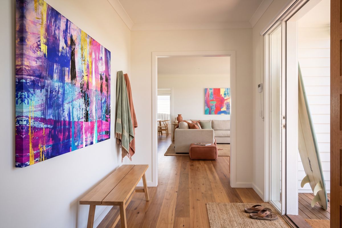 Coastal home, entry, with a child's design on stretched canvas