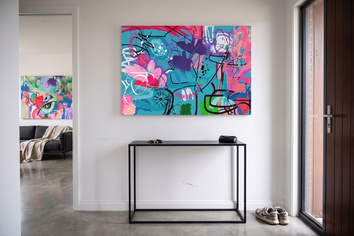Minimal home, entry, with a child's design on stretched canvas